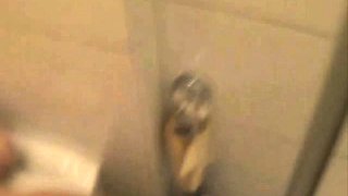 Amatuer brunette fills her ass with a big dildo and piss