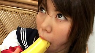 Asian teen with a banana