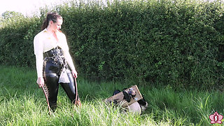 Slave Mila Endures Clamps, Whipping, and Humiliation in the Field for Vivienne L'amour's Delight