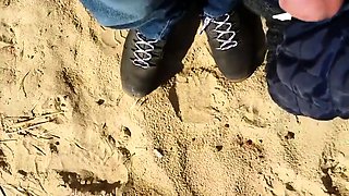 Beach voyeur jerks his cock while a sexy babe enjoys the sun