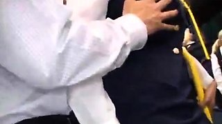 Big breasted European babe gives a sensual handjob in public