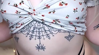 amateur tattooed blonde oils her pierced tits