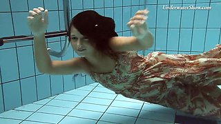 Russian teen diving while showing off her natural tits