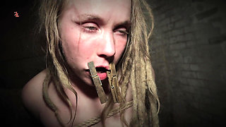 Clamps at the Body of a Tied up Moaning Witch