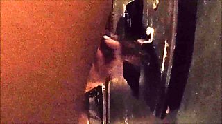 Wife enjoys a BBC through glory hole part 1