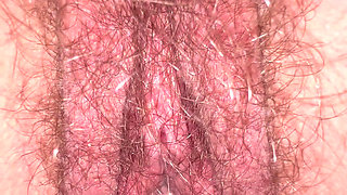 Creamy juices dripping in slowmotion from inside wife's hairy bush closeup