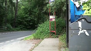 Pretty brunette is nearly caught pissing in a bus stop!