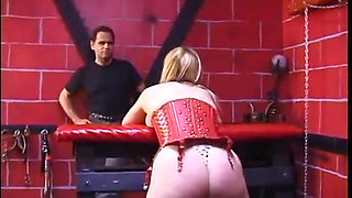 Blonde with huge bruised tits is teased by female temptresses in bondage dungeon
