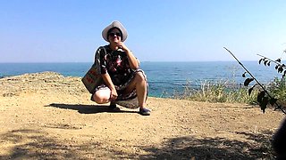 Naughty mature lady flashes her hairy beaver in the outdoors