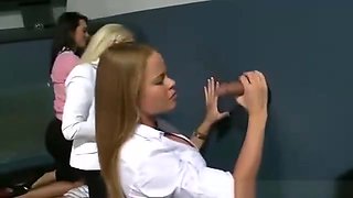 CFNM babes sucking at the gloryhole