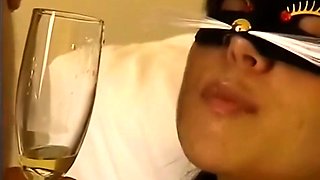 Masked brunette with lovely tits feeds her lust for hot piss