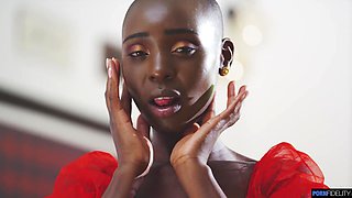 African bald beauty Zaawaadi takes a white cock inside.