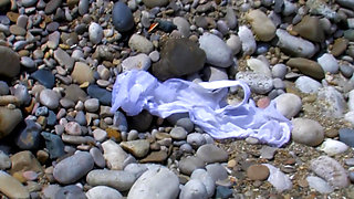 When the blonde is on a beach she gets really horny and looks for something to fuck