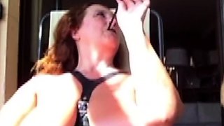 Big tit brunette amateur fucks a dildo close up