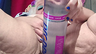 Big Bottle Plugged Clit Cunt