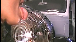 Blonde whore gets fucked by a black cock on the hood of the car