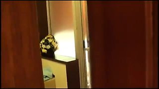 Voyeur spying on a delightful Oriental teen in the bathroom