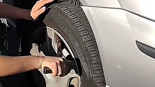 Dirndl Slut Gets Dirty and Oily Changing Tires