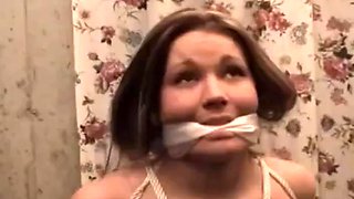 Nude, wearing a cleave-gag