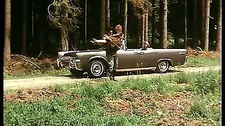Retro girl gets fucked on top of a driving car