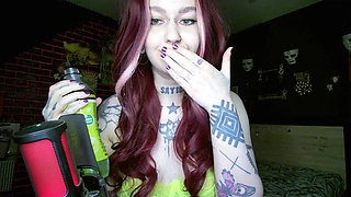 Sexy Alternative Redhead Drinking Soda and Burping