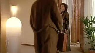 German femdom babe dominates a man in a suit