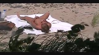 voyeur catches MILF on a beach