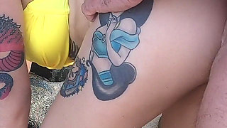 Tattooed MILF Nery Takes Hard Doggy Pounding on Beach