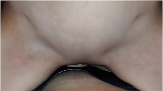 Girl on top rides a thick strap-on with passion